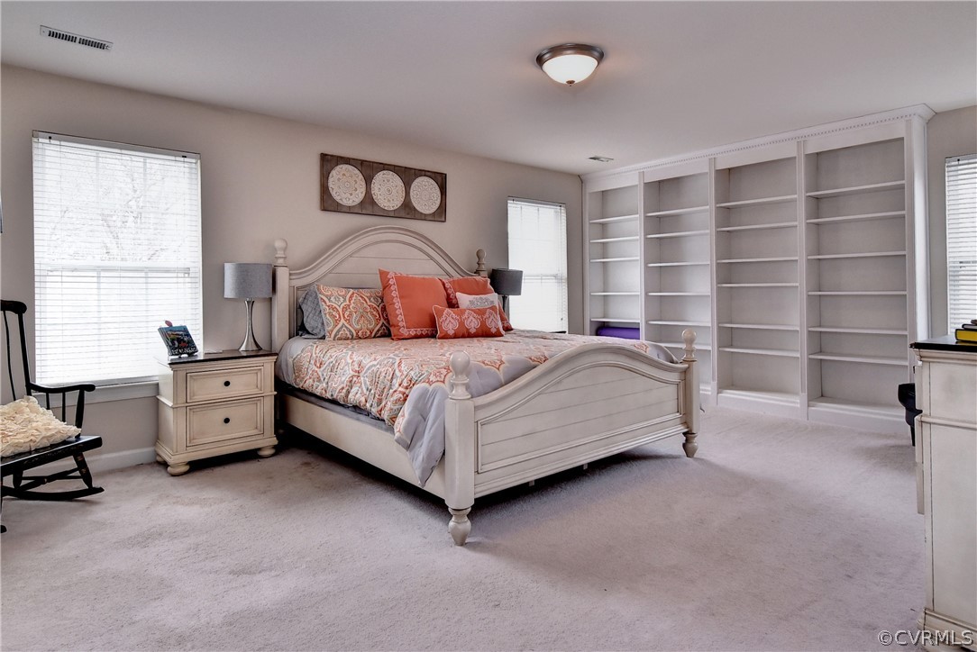 3986 Bournemouth Bend Williamsburg, VA 23188 - Photo 18 of 47 a bedroom with a bed and a window