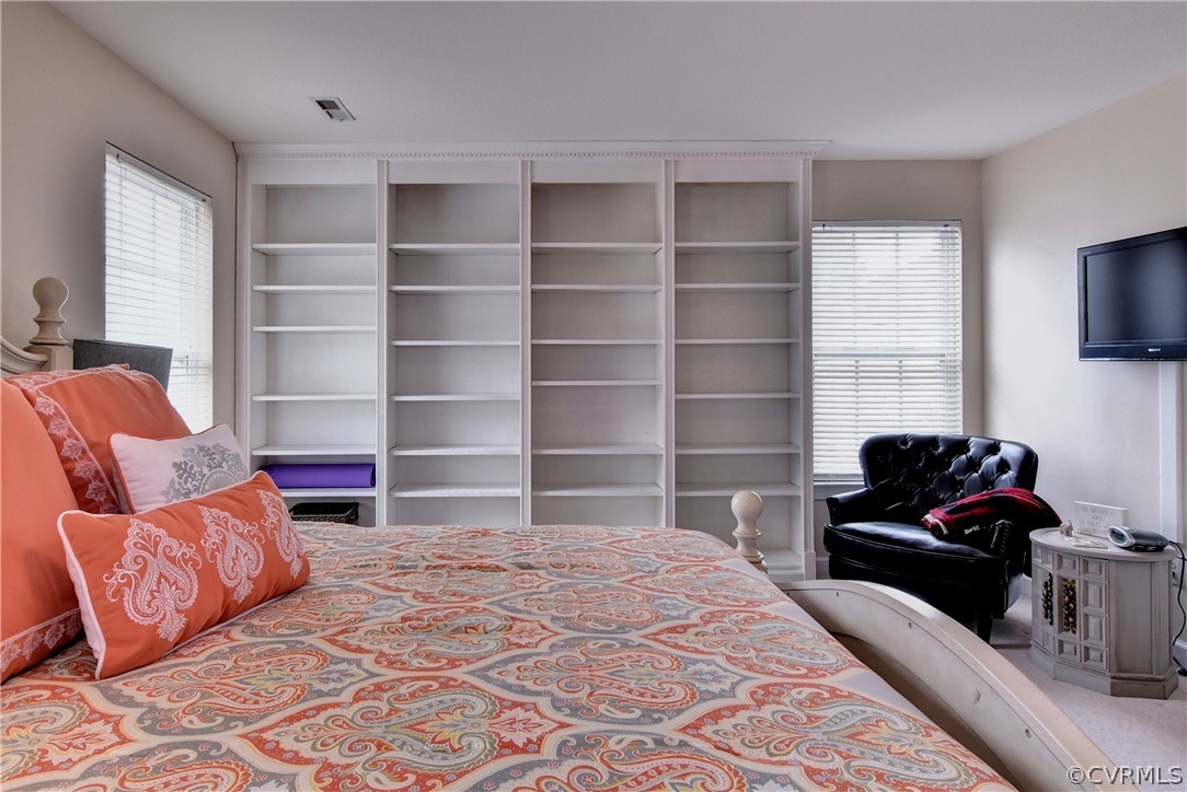 3986 Bournemouth Bend Williamsburg, VA 23188 - Photo 19 of 47 a bedroom with a bed and a television