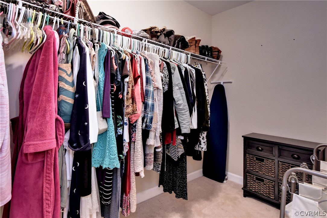 3986 Bournemouth Bend Williamsburg, VA 23188 - Photo 22 of 47 a view of walk in closet with clothes and shoes