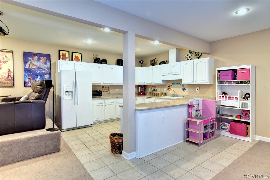 3986 Bournemouth Bend Williamsburg, VA 23188 - Photo 30 of 47 a kitchen with refrigerator and cabinets