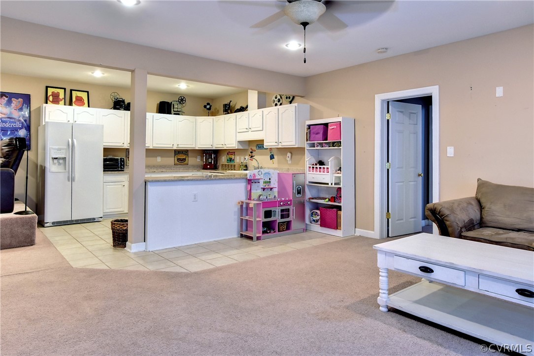 3986 Bournemouth Bend Williamsburg, VA 23188 - Photo 34 of 47 a bedroom with furniture and a chandelier