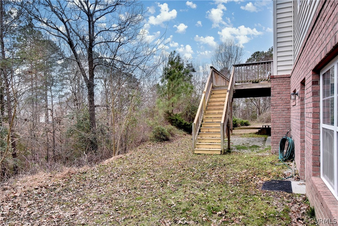 3986 Bournemouth Bend Williamsburg, VA 23188 - Photo 39 of 47 a view of a house with a yard