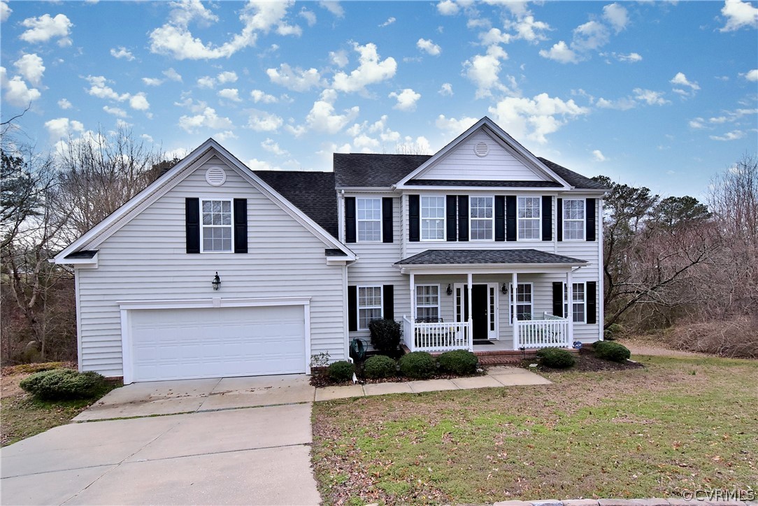 3986 Bournemouth Bend Williamsburg, VA 23188 - Photo 41 of 47 a front view of a house with yard and parking