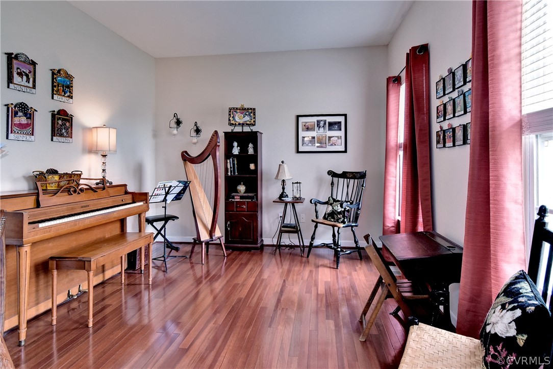 3986 Bournemouth Bend Williamsburg, VA 23188 - Photo 5 of 47 a view of a workspace with furniture and wooden floor