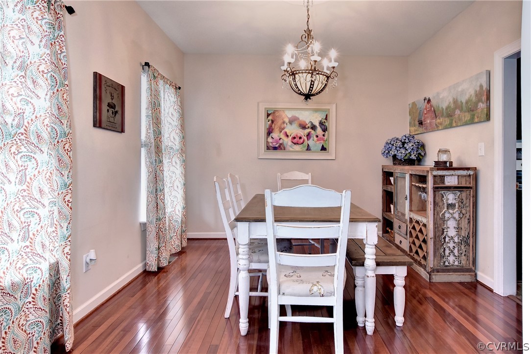 3986 Bournemouth Bend Williamsburg, VA 23188 - Photo 6 of 47 a view of a dining room with furniture wooden floor and chandelier
