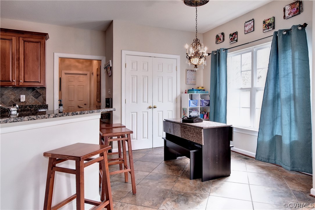 3986 Bournemouth Bend Williamsburg, VA 23188 - Photo 10 of 47 a dining room with furniture and window