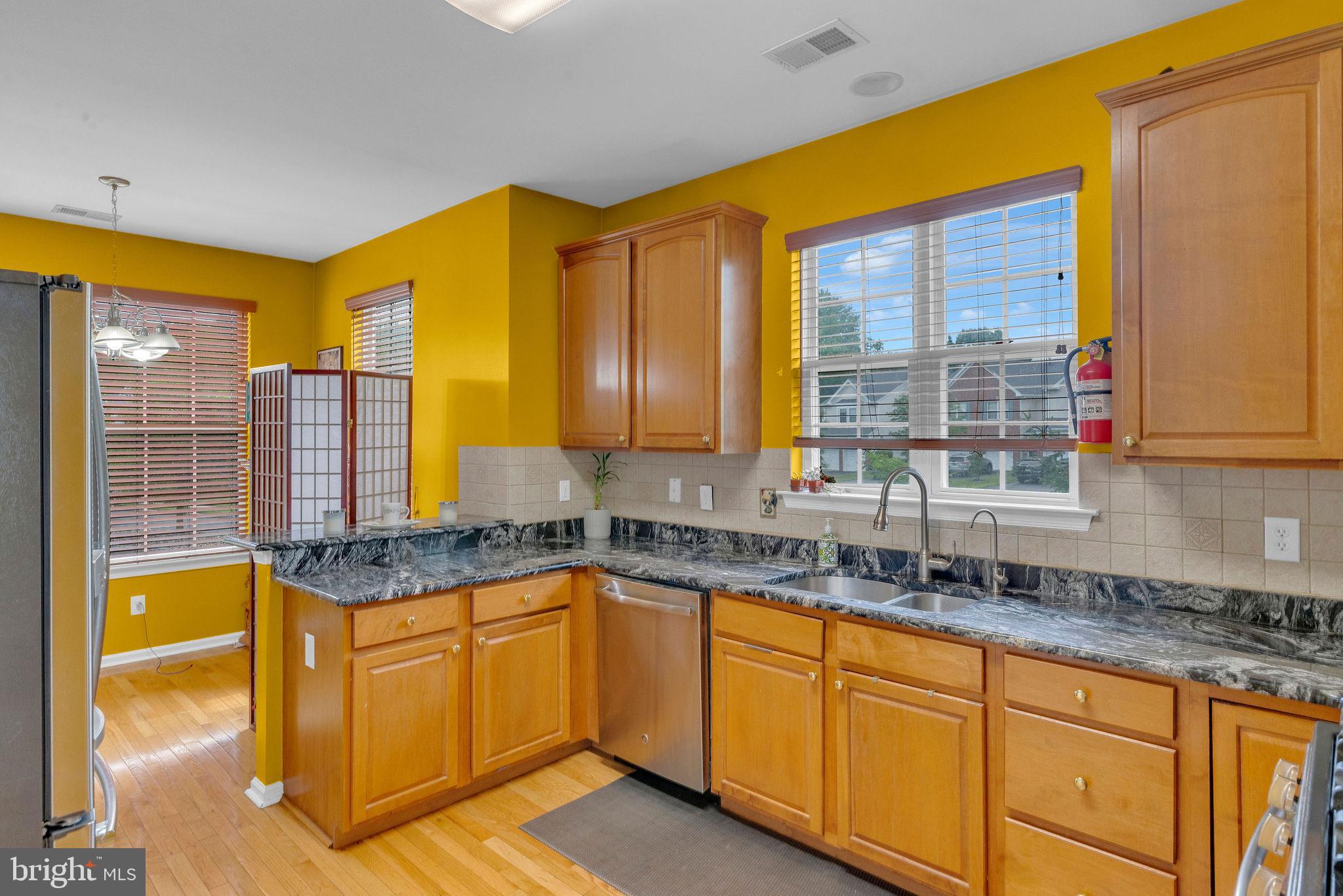16 Cardiff Court Princeton Junction, NJ 08550 - Photo 19 of 60 a kitchen with a sink a counter top space and cabinets