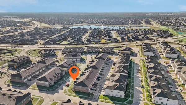 an aerial view of residential building and parking space