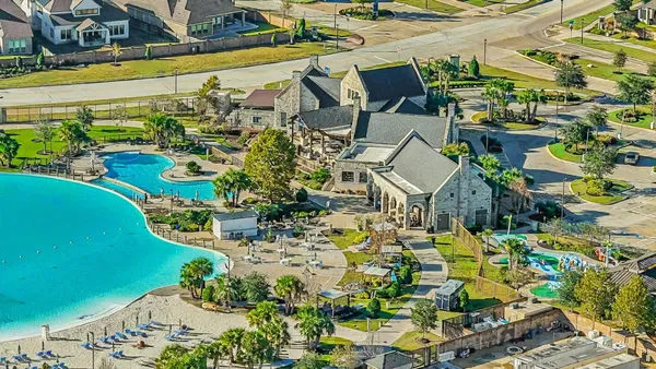 a view of swimming pool with outdoor seating