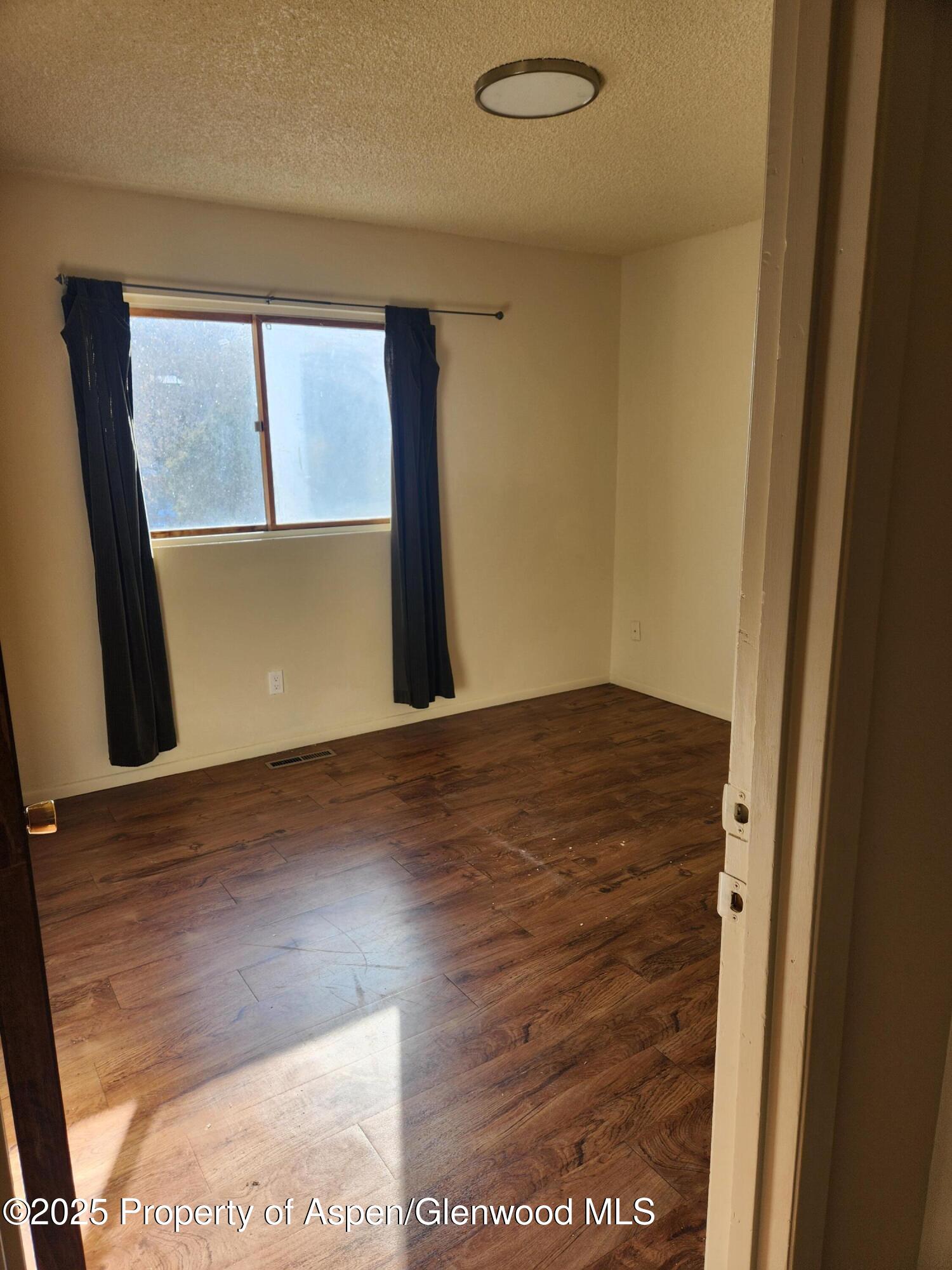 702 Midland Avenue Glenwood Springs, CO 81601 - Photo 4 of 7 a view of an empty room