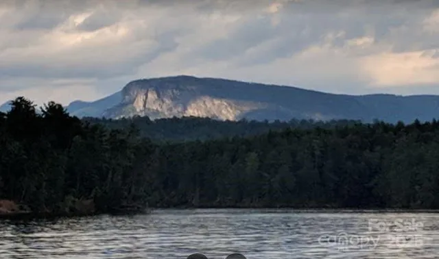 a view of swimming pool and mountain in the back