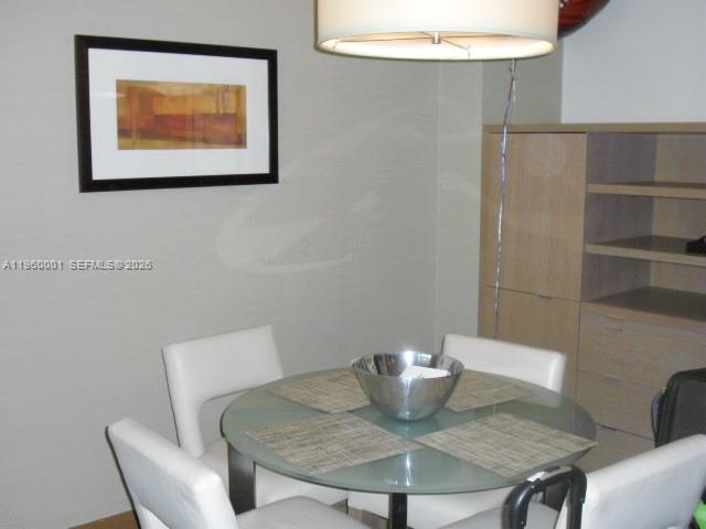 1395 Brickell Avenue, Unit 3210 Miami, FL 33131 - Photo 3 of 10 a view of a dining room with furniture