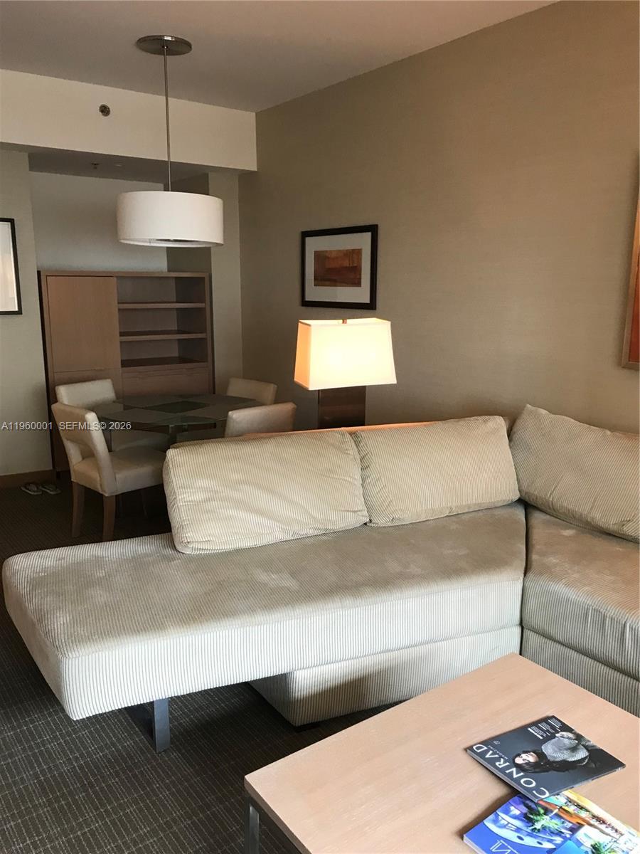 1395 Brickell Avenue, Unit 3210 Miami, FL 33131 - Photo 4 of 10 a living room with furniture