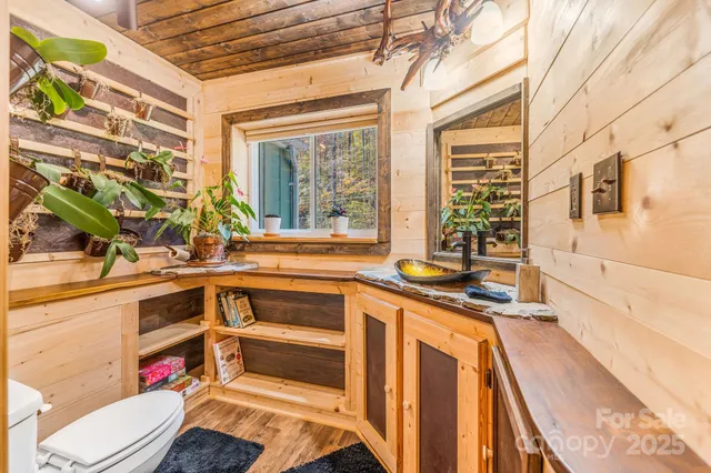 a kitchen with a sink and a stove next to a window
