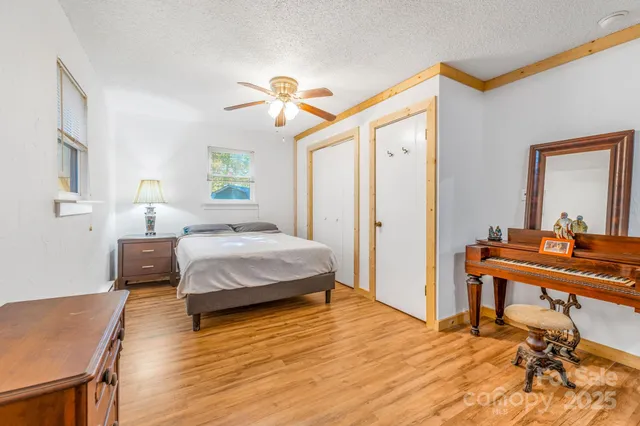 a bedroom with a bed and a desk