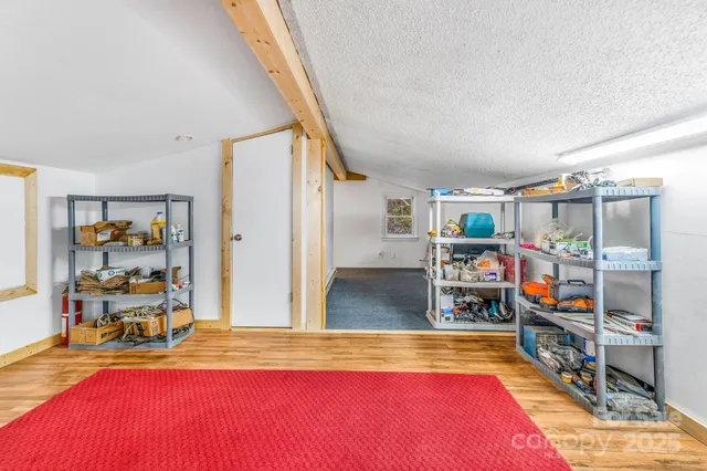 a living room with lots of furniture and a wooden floor