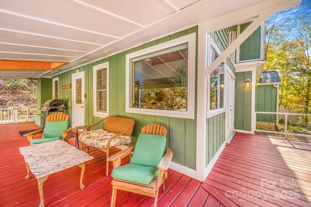 a dining room with wooden floor and furniture