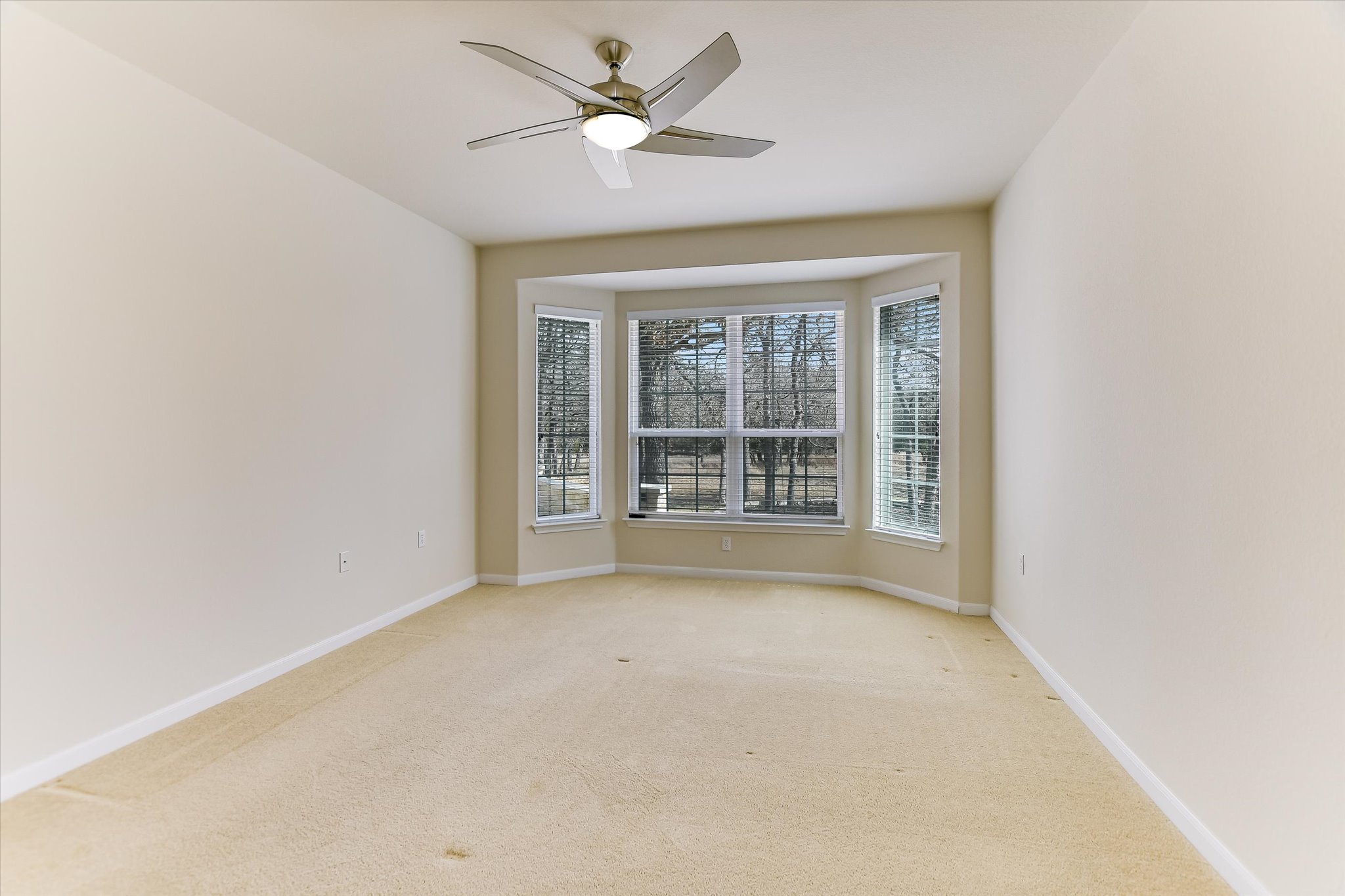 418 Monarch Trail Georgetown, TX 78633 - Photo 13 of 24 an empty room with a window and a ceiling fan