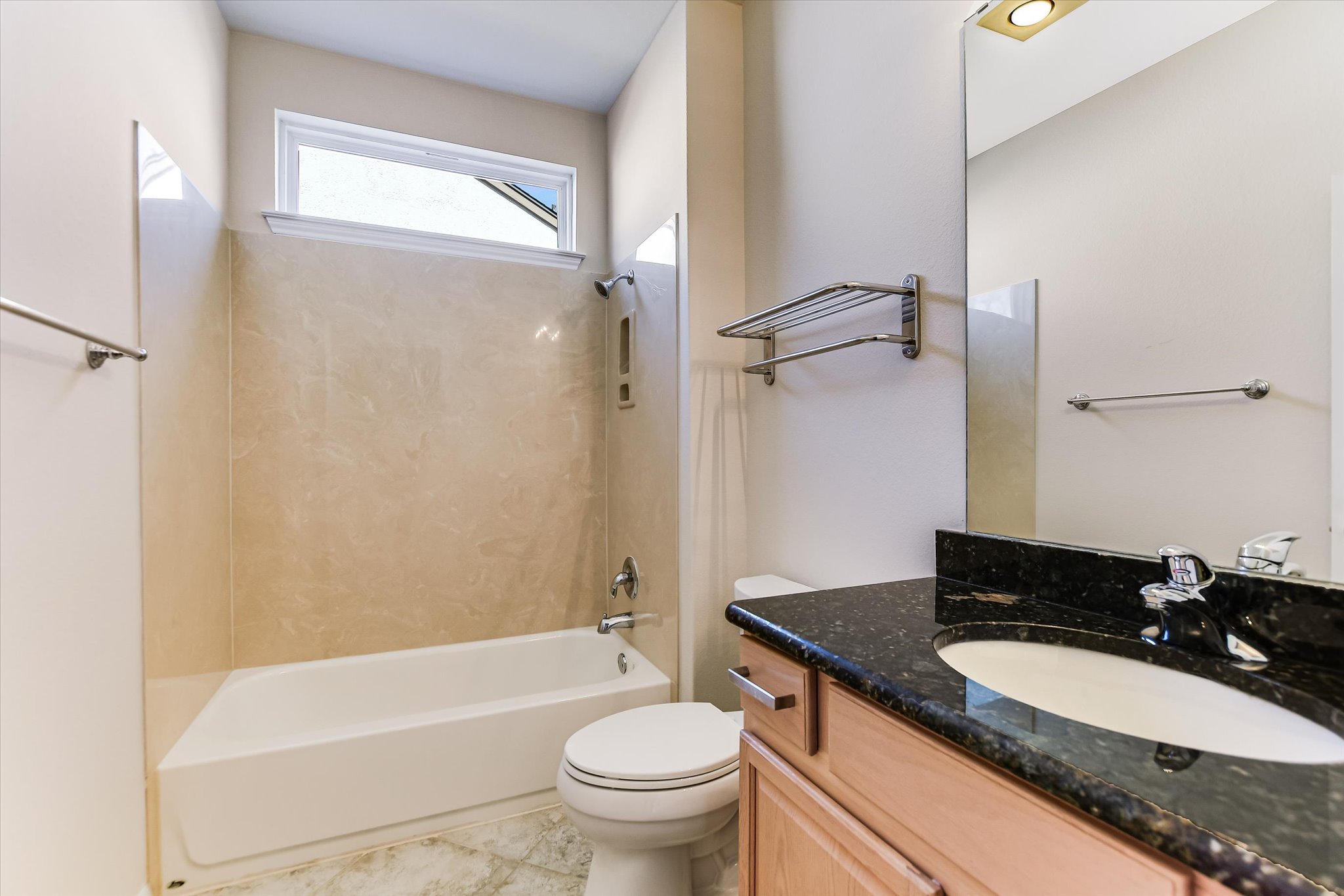 418 Monarch Trail Georgetown, TX 78633 - Photo 17 of 24 a bathroom with a granite countertop sink a toilet a mirror and bathtub