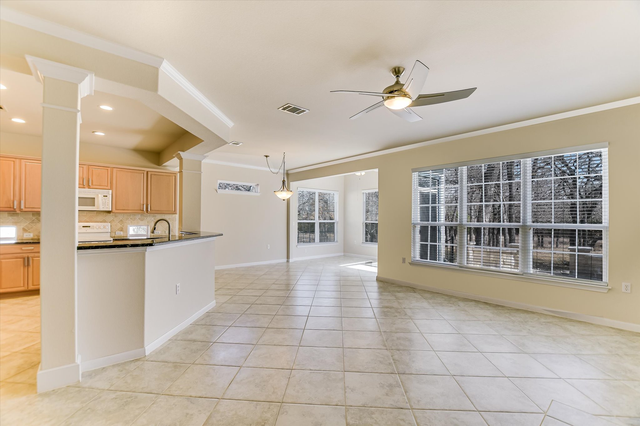 418 Monarch Trail Georgetown, TX 78633 - Photo 5 of 24 a view of an entryway with wooden floor and a kitchen