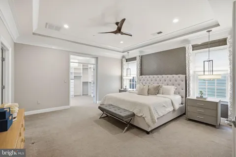 a spacious bedroom with a bed and window