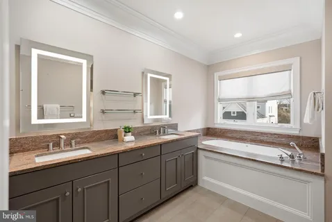 a bathroom with a sink and a window