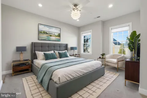 a bedroom with bed and a chandelier