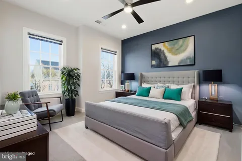 a bedroom with a bed and a couch