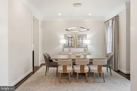 a view of a dining room with furniture and window