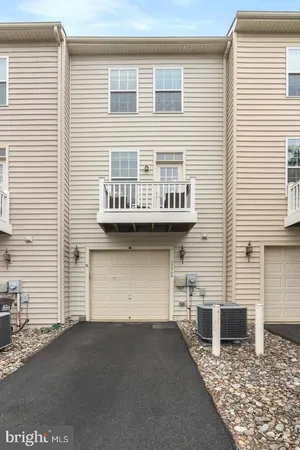 a front view of a house with a garage