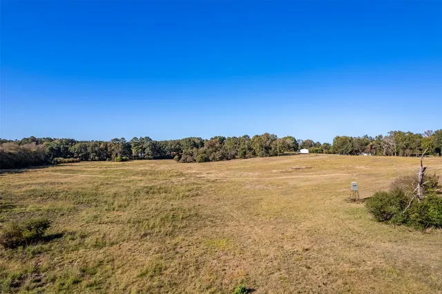 a view of lake with green valley