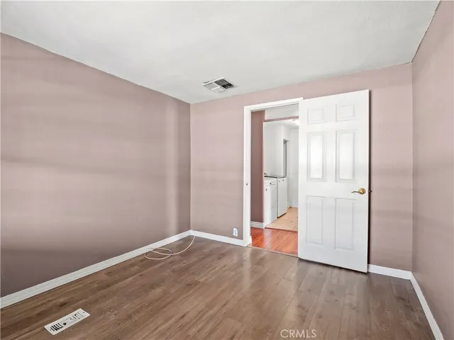 a bathroom with a granite countertop sink a mirror and a shower