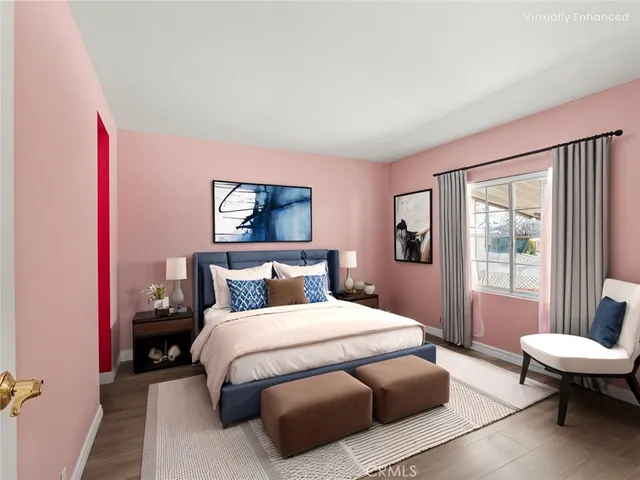 a view of a room with wooden floor and entryway