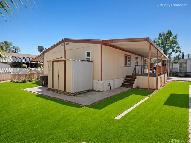 a view of a house with a snow in the background