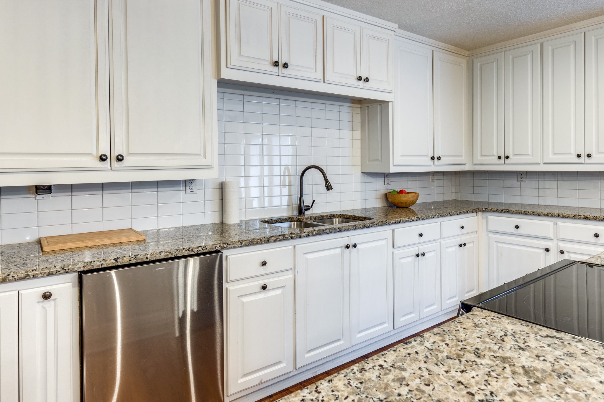 340 Old Spring Creek Road Estill Springs, TN 37330 - Photo 16 of 60 a kitchen with granite countertop white cabinets and sink