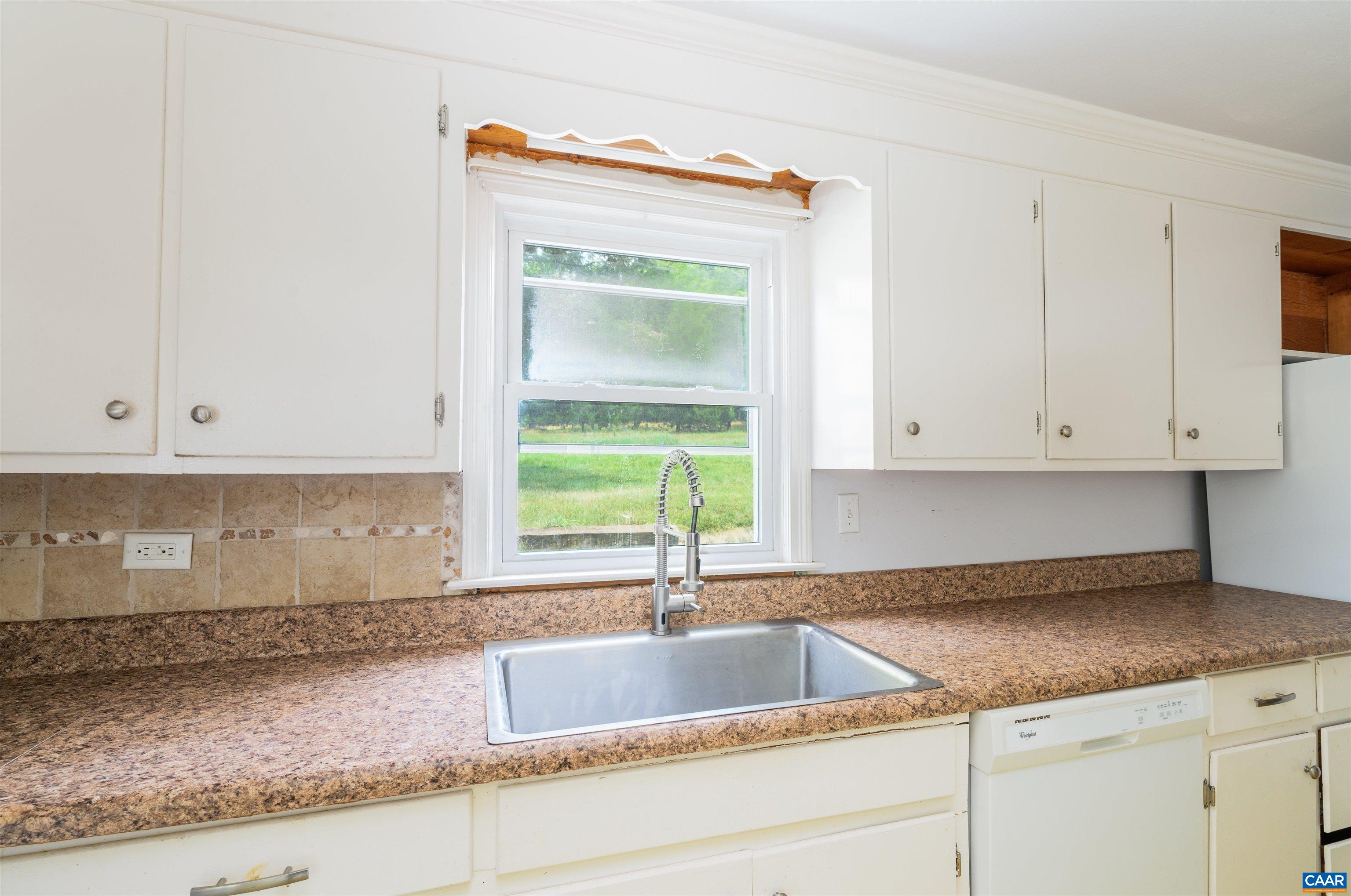 3072 Stony Point Road Charlottesville, VA 22911 - Photo 11 of 41 a kitchen with granite countertop white cabinets and a sink