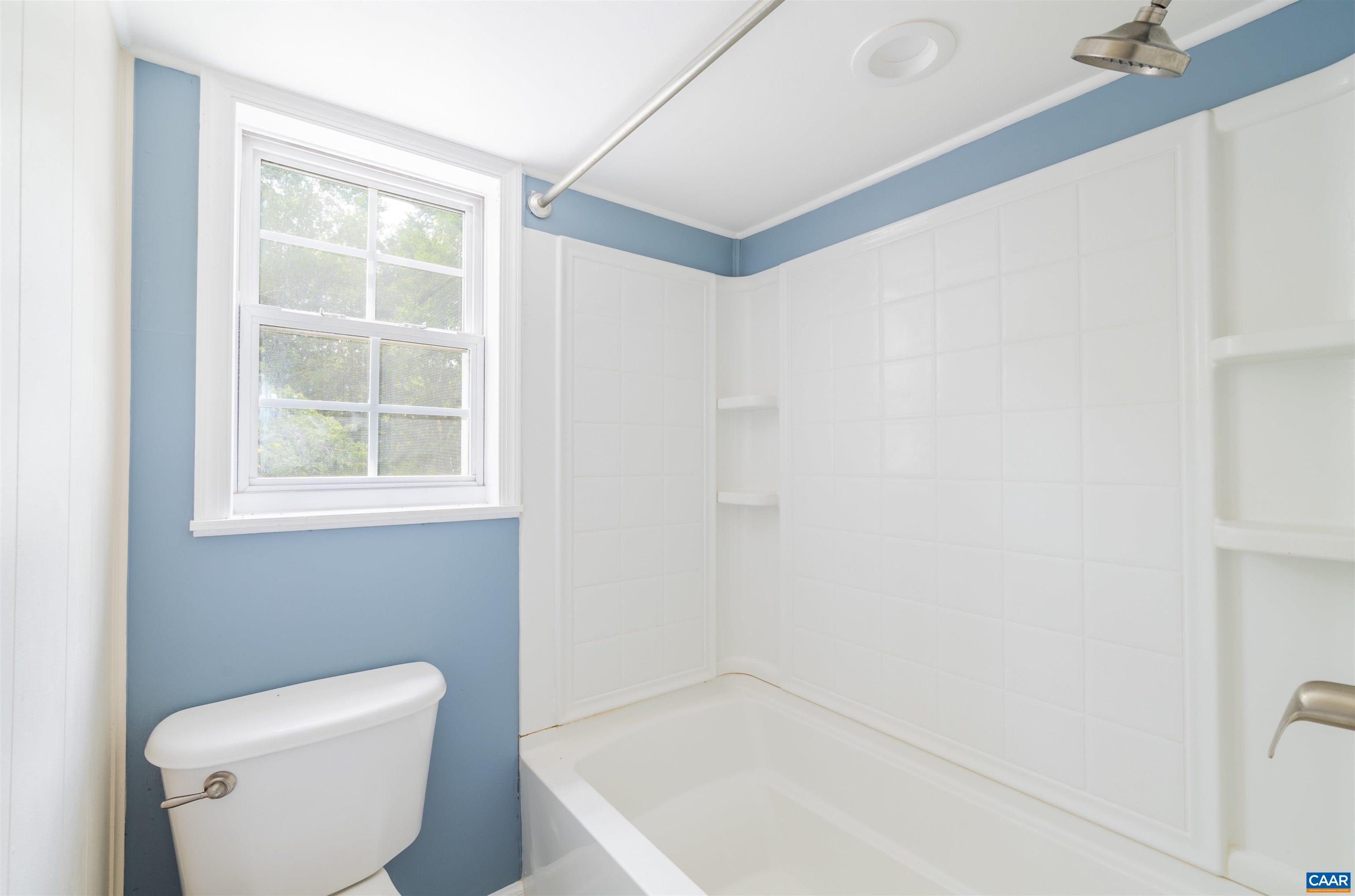 3072 Stony Point Road Charlottesville, VA 22911 - Photo 16 of 41 a bathroom with a toilet a sink and a window