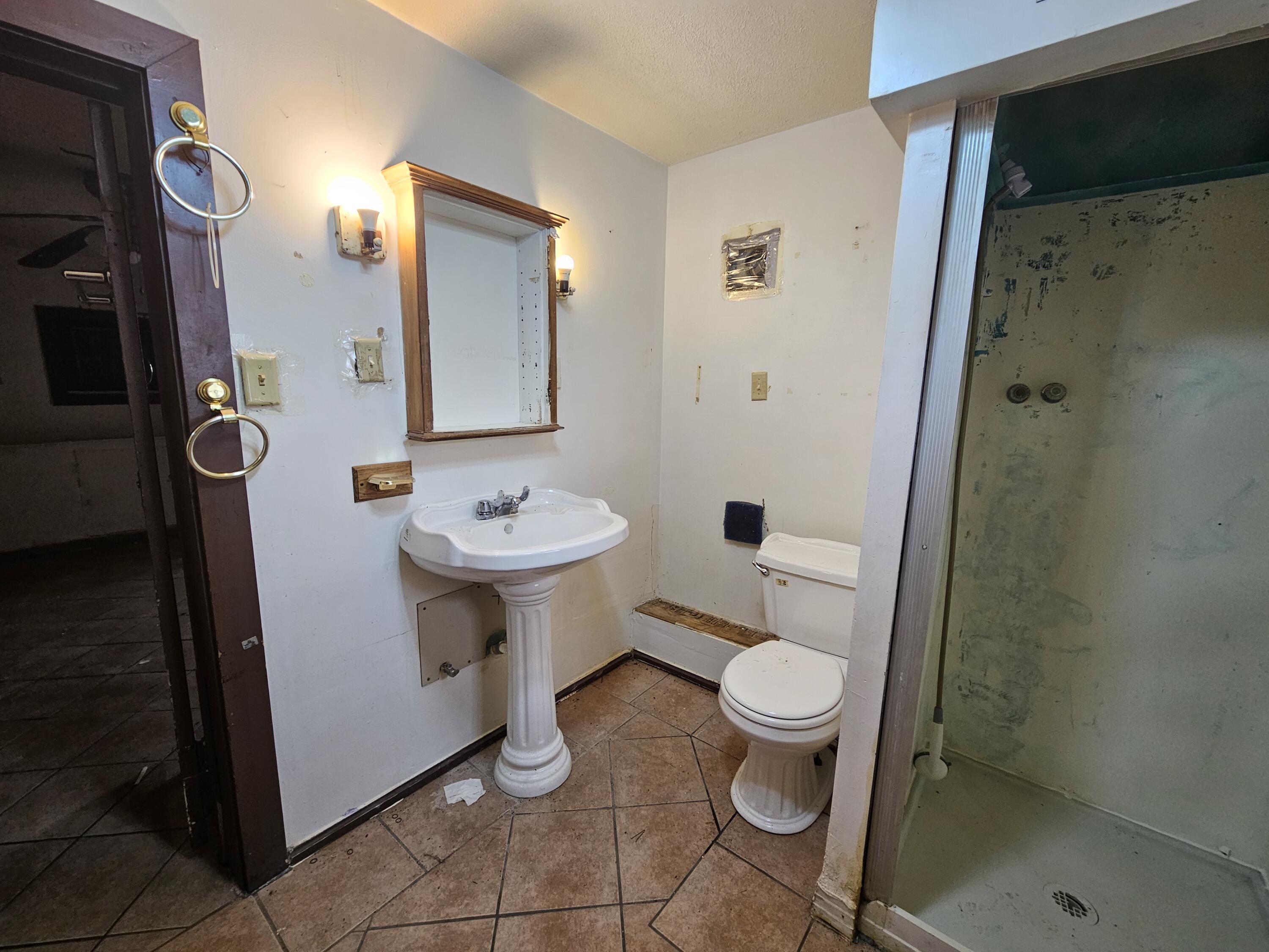 5235 Stair Road Lafayette, IN 47905 - Photo 6 of 15 a bathroom with a sink toilet and shower