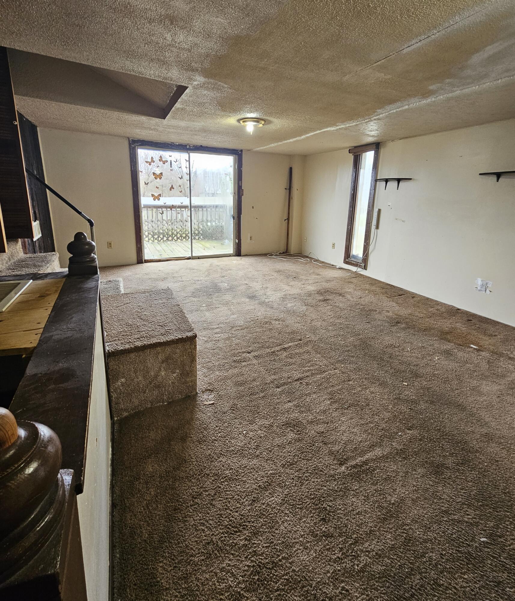 5235 Stair Road Lafayette, IN 47905 - Photo 7 of 15 a big room with wooden floor and windows