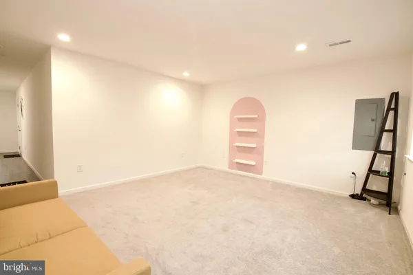 a living room with a couch and a flat screen tv