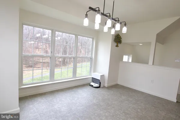 a stove top oven sitting inside of a kitchen