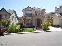 front view of a house with a street