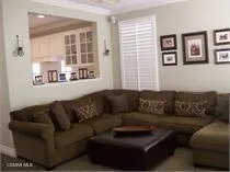 a living room with furniture and windows