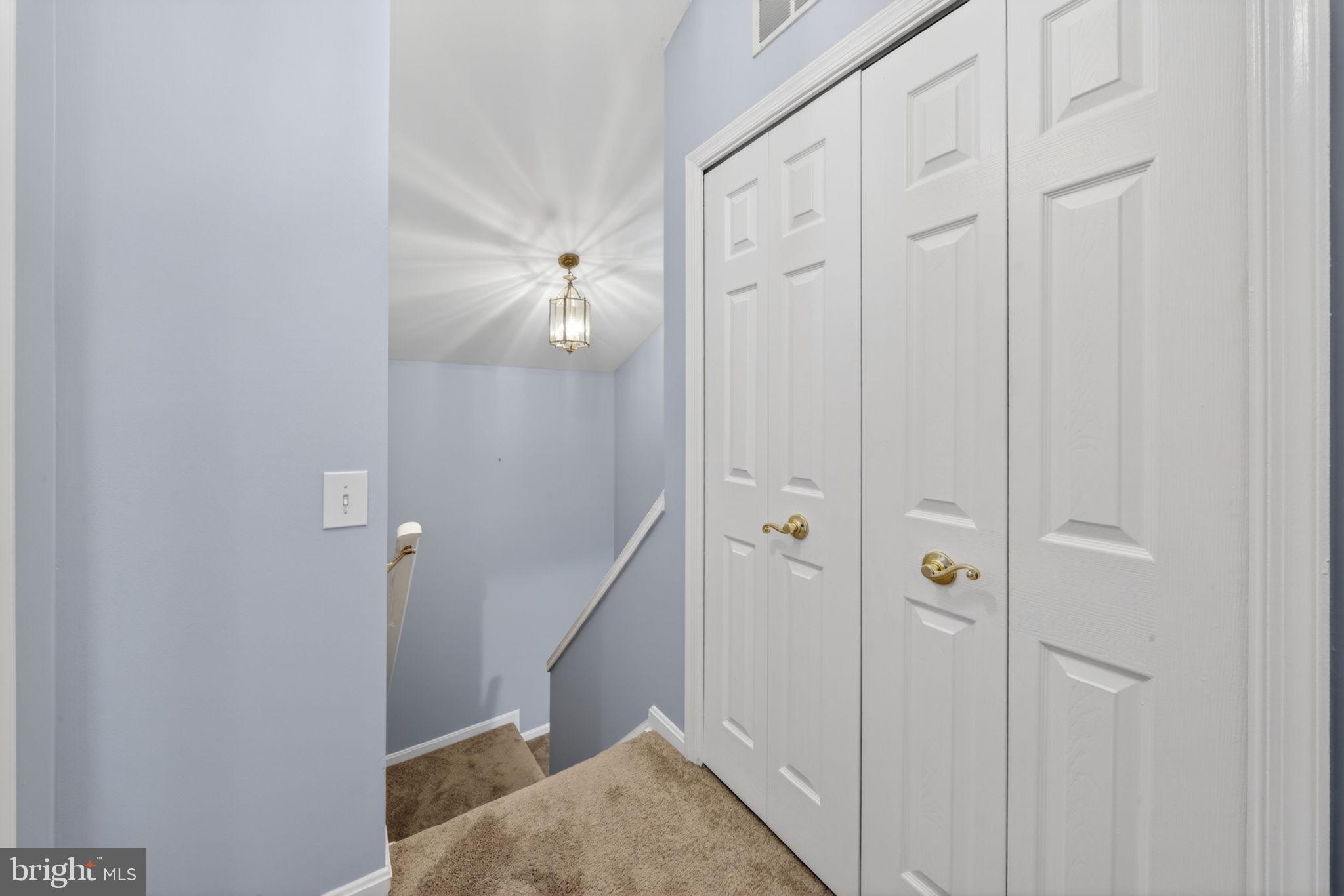 6006 Lincolnia Road Alexandria, VA 22312 - Photo 31 of 42 Inviting staircase with soft lighting.