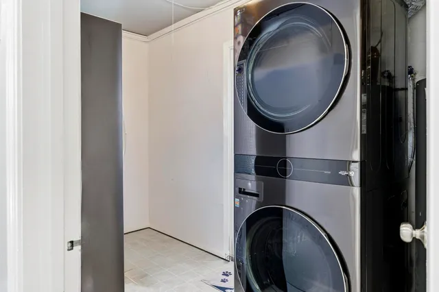 a close view of a utility room with dryer and washer