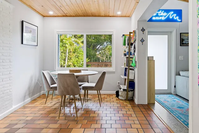 a view of a dining room with furniture window and outside view