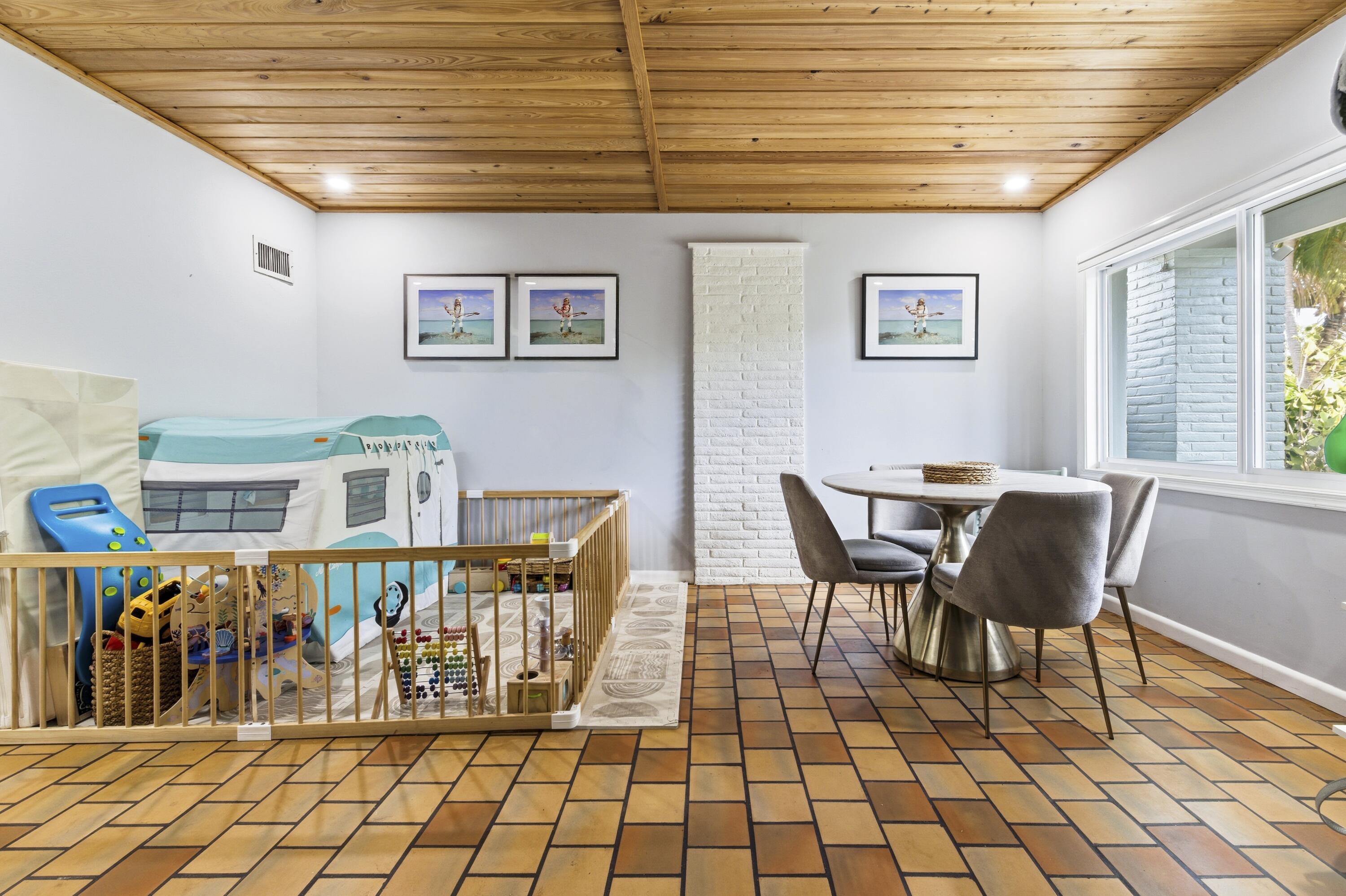 1119 North M Street Lake Worth Beach, FL 33460 - Photo 17 of 26 a dining room with furniture and next to a window