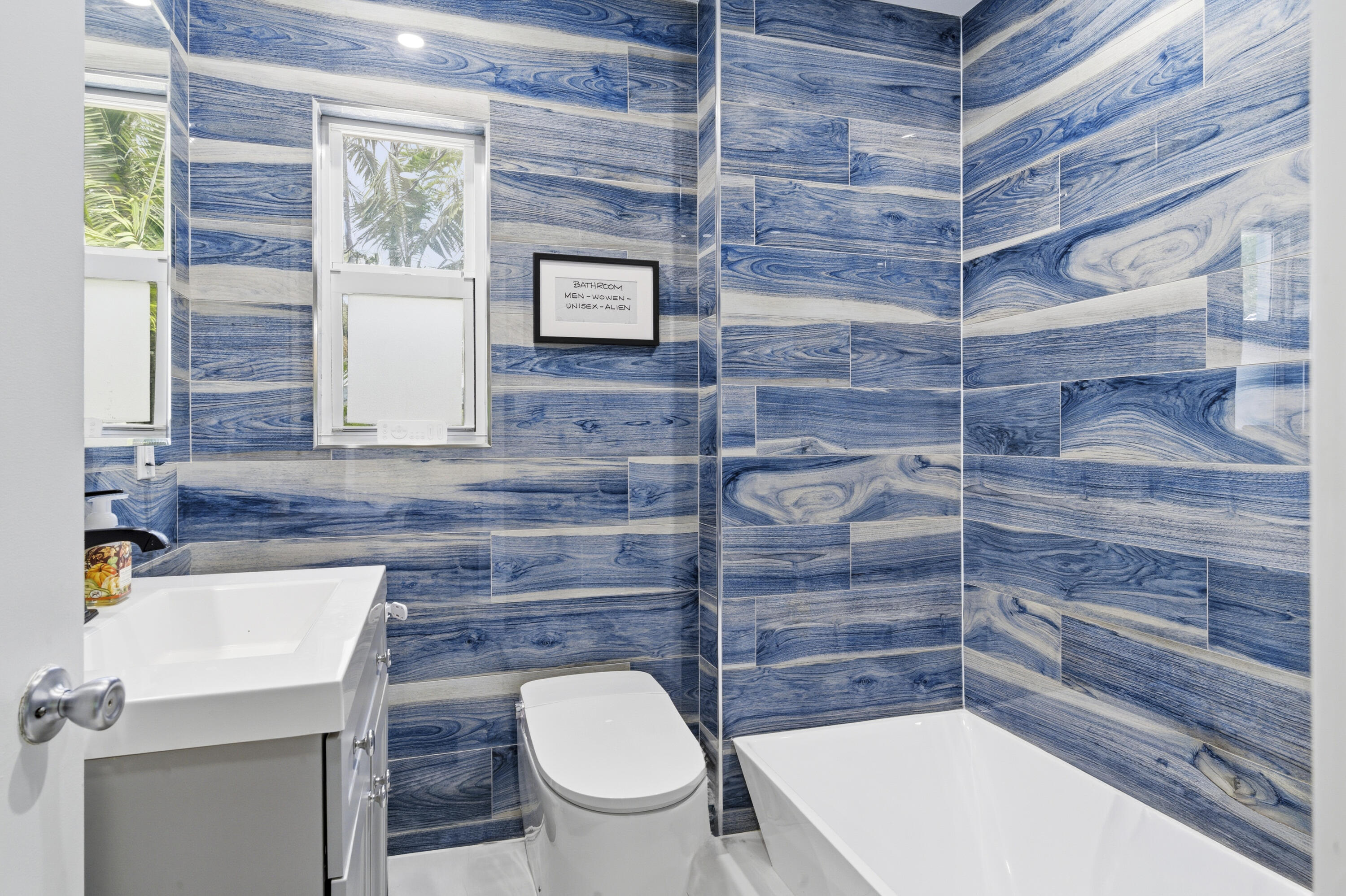 1119 North M Street Lake Worth Beach, FL 33460 - Photo 20 of 26 a bathroom with a toilet a sink and window