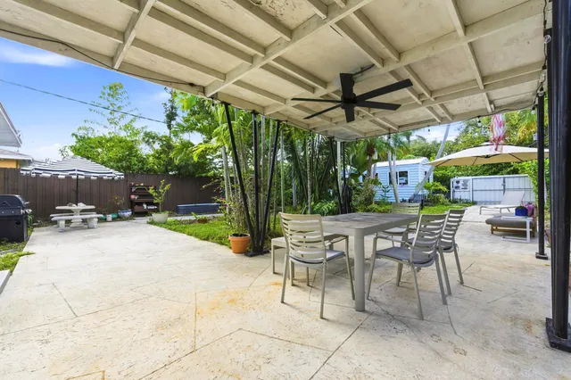 a view of a chairs and table in a patio