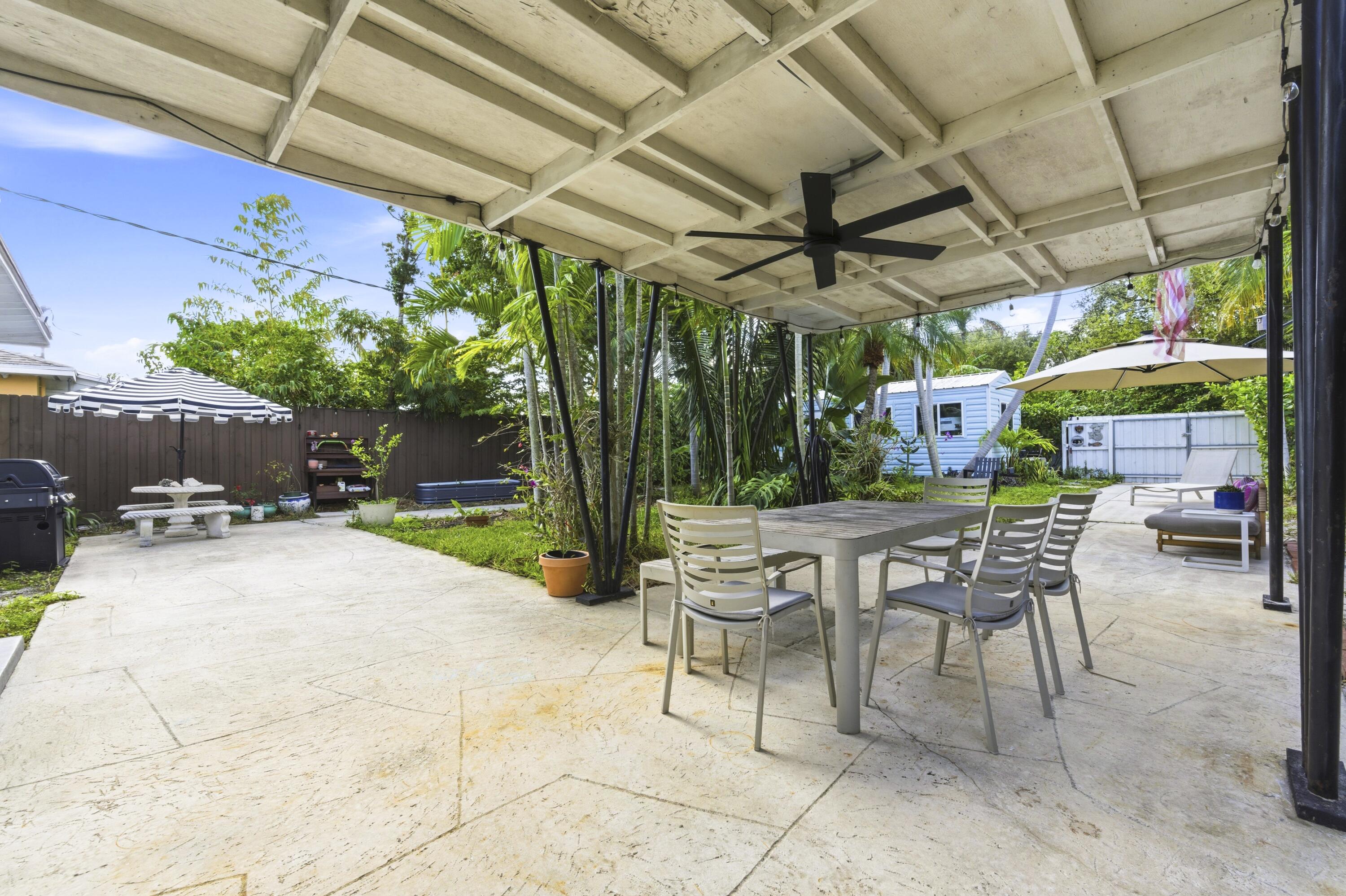 1119 North M Street Lake Worth Beach, FL 33460 - Photo 22 of 26 a view of a chairs and table in a patio